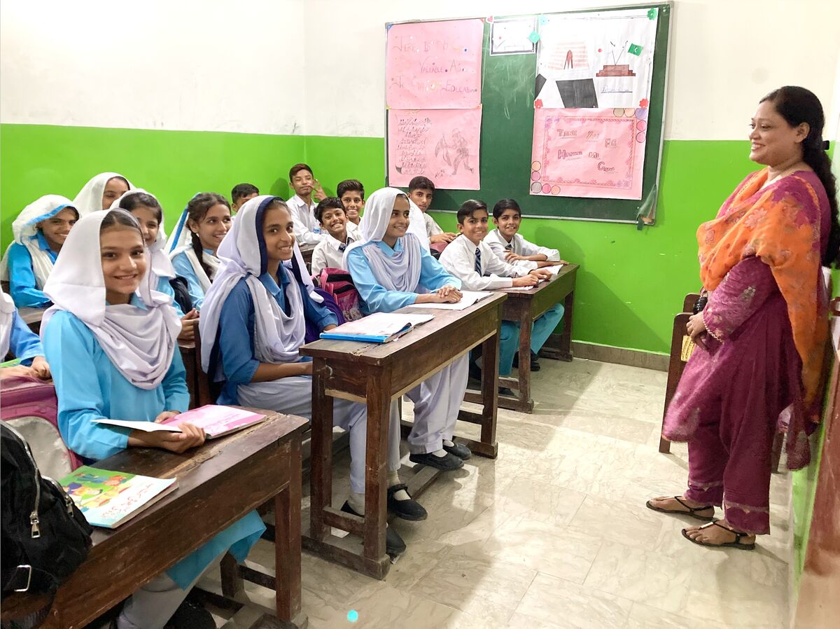 A teacher with students at a Hope school